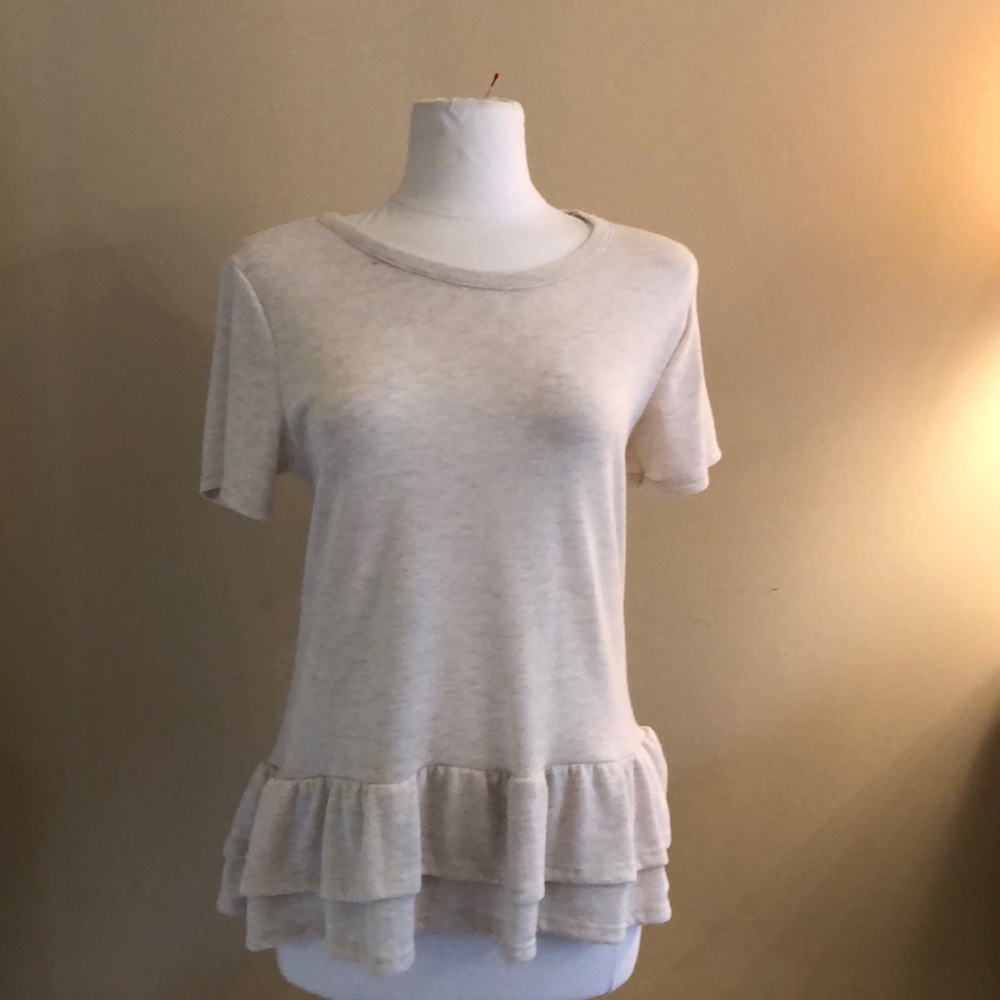 Beige casual ruffle bottom shirt